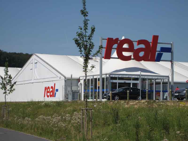 Zur News: Neptunus errichtet temporären real,- Markt