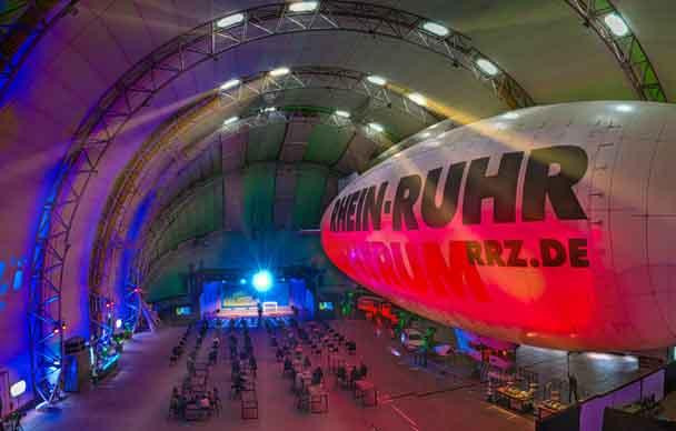 Zur News: Eventbranche entdeckt Luftschiffhalle als neue Location – Aventem ist fester Kooperationspartner